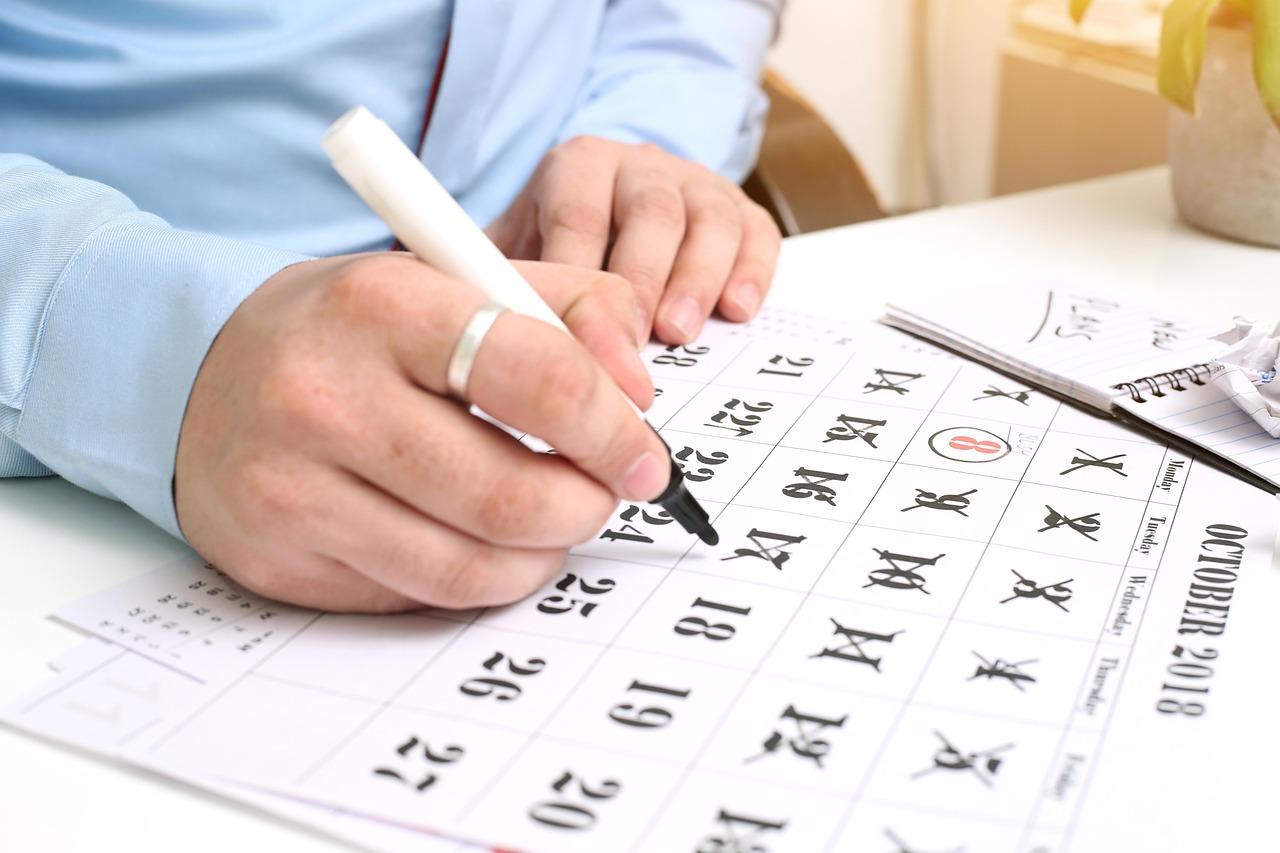 writing hand calendar pen dates 7702615